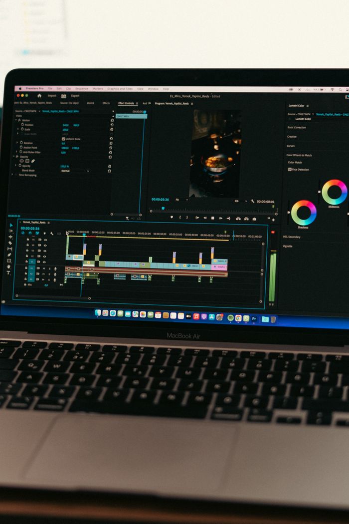 MacBook Air displaying video editing software interface, ideal for technology and digital content themes.